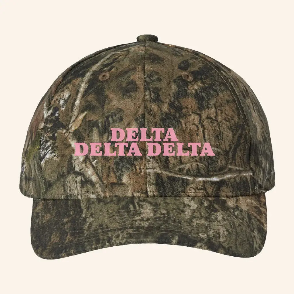 ADPI Merch Delta Delta Delta Pink Embroidered Camo Hat Birthday Present For Wife -WearandDecor ADPI Merch Delta Delta Delta Pink Embroidered Camo Hat Birthday Present For Wife -WearandDecor - Image 1