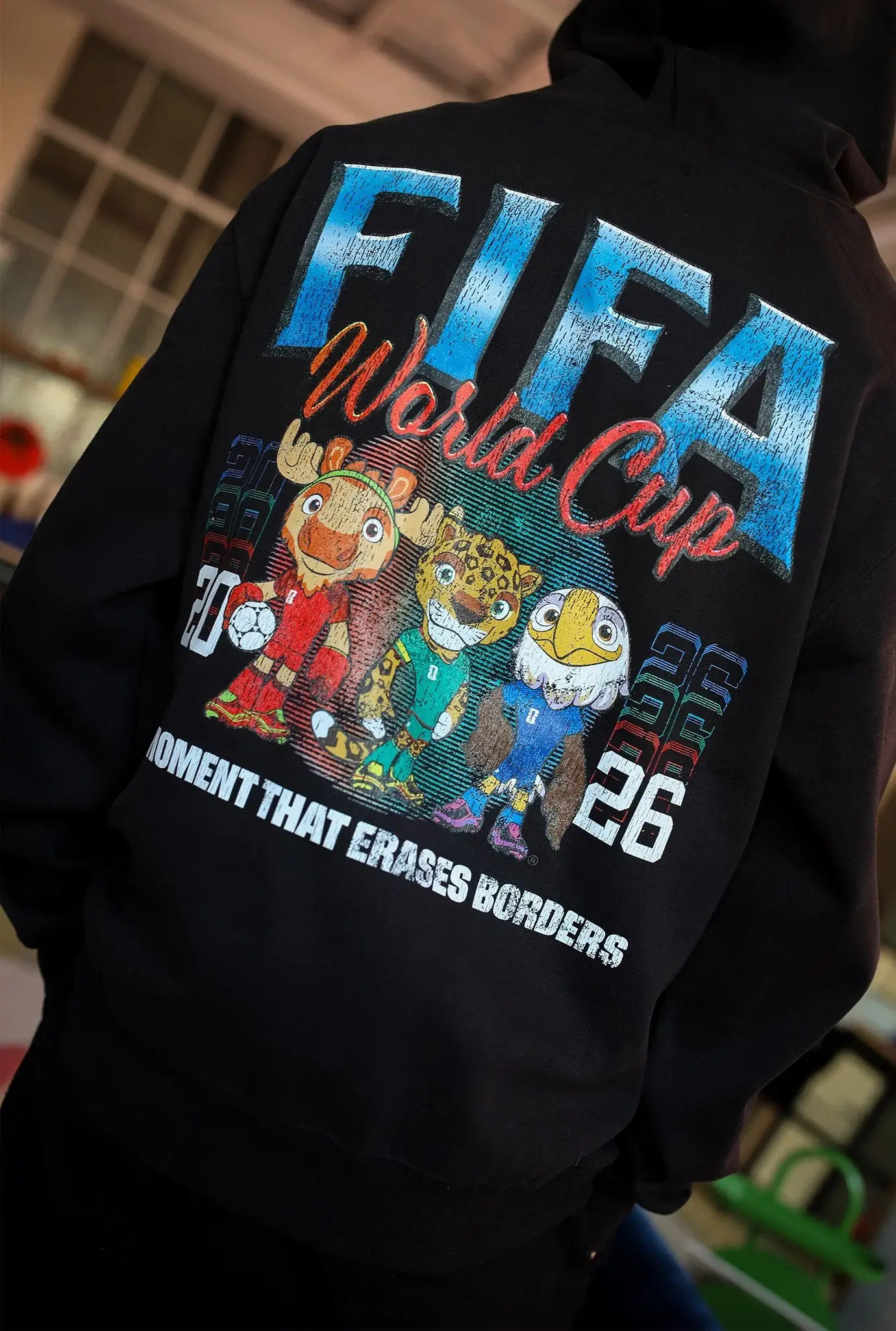 Mascot Moment That Erases Borders Hoodie FIFA World Cup 2026 Apparel Soccer Fans